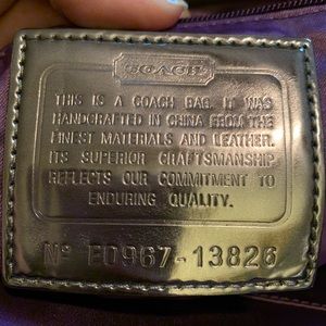 Black and silver Coach “Poppy” purse